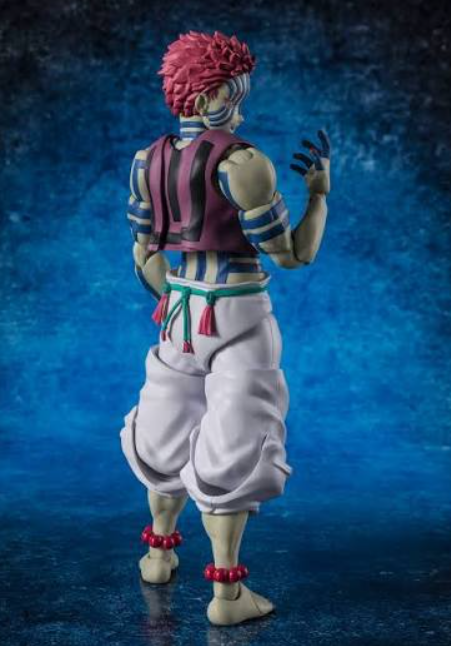 A collectible action figure of a character from Demon Slayer, shown from the back on a textured blue background.
