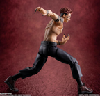 Action figure of Sukuna in a dynamic pose against a red background